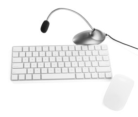 Professional microphone, keyboard and mouse on white background