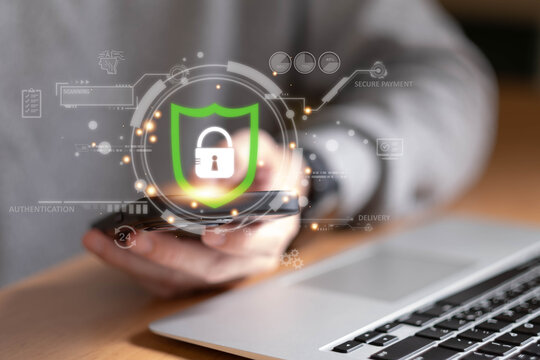 People hand using smartphone and laptop to make payment for online shopping application. Digital payment secure online transaction for online marketplace. Secure payment process to prevent fraud