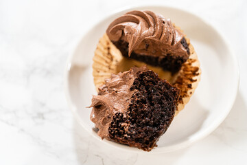 Chocolate Cupcake Sliced in Half on Kitchen Counter