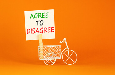 Agree to disagree symbol. Concept words Agree to disagree on beautiful white paper on wooden...