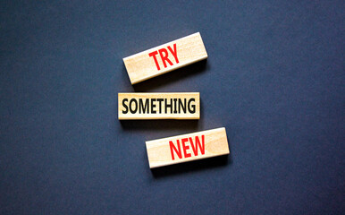 Try something new symbol. Concept words Try something new on beautiful block. Beautiful black table...