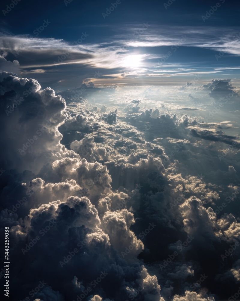 Poster aerial view of majestic cumulus clouds illuminated by sunlight creating a dramatic and ethereal atmo