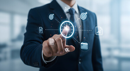 Man in Blue Suit Touching Digital Interface with Floating Business Icons Against Blurred Background