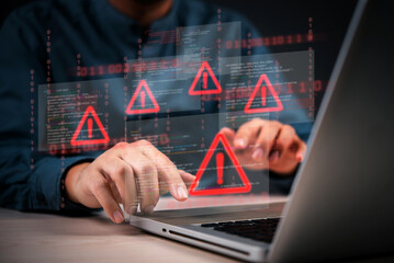 Cybersecurity warning with coding glitch and malware alert shown on digital interface, representing data breach and system vulnerability.Hacking attempt detected with virus icons on computer screen.