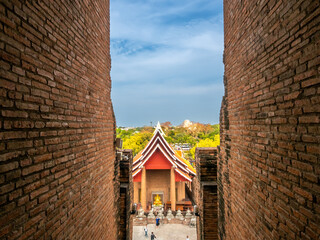 Wat Yai Chaimongkol, one of the UNESCO World Heritage place Ayudhaya, Thailand, ancient pagoda and buildings with surrounding a lot of buddha statues in outdoor under blue sky in summer