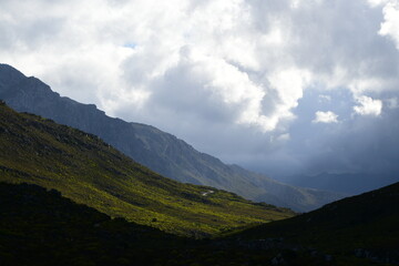 Serene South African Countryside Landscape with Green Fields and Distant Rolling Hills and mountains 