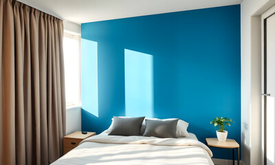 Bright bedroom with a blue accent wall and cozy bed, inviting mood with natural light