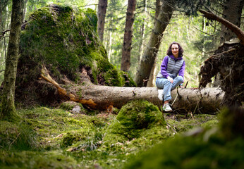 Woman tourist in a beautiful forest in Skrylle naturreservat Lund Skane Sweden 