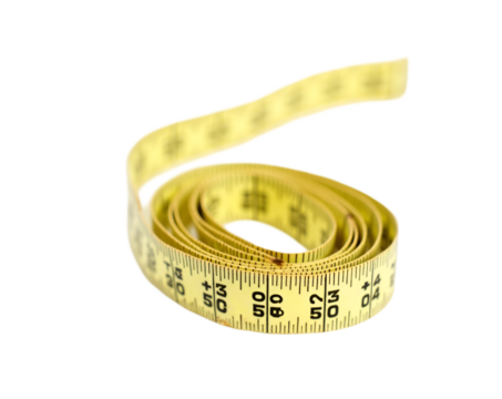 A Curled Measuring Tape, Capturing Concepts of Measurement, Precision, and Utility in Graphic Design and Construction Related Projects, Isolated on a Background