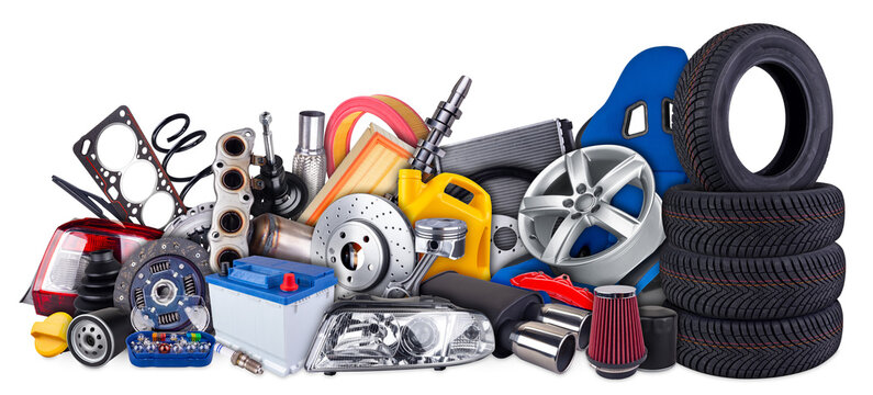huge stack pile of  car parts including seat wheels, tires, filters, and engine components isolated white background. automotive vehicle repair and service industry concept.