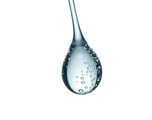 A highly magnified solitary rain droplet suspended in air exhibiting flawless transparency and surface tension phenomena with minute bubbles trapped inside the water