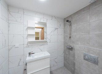 Modern Minimalist Bathroom with White and Gray Tile Design and Fixtures