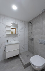 Modern Bathroom with White Tiles and Contemporary Finishes