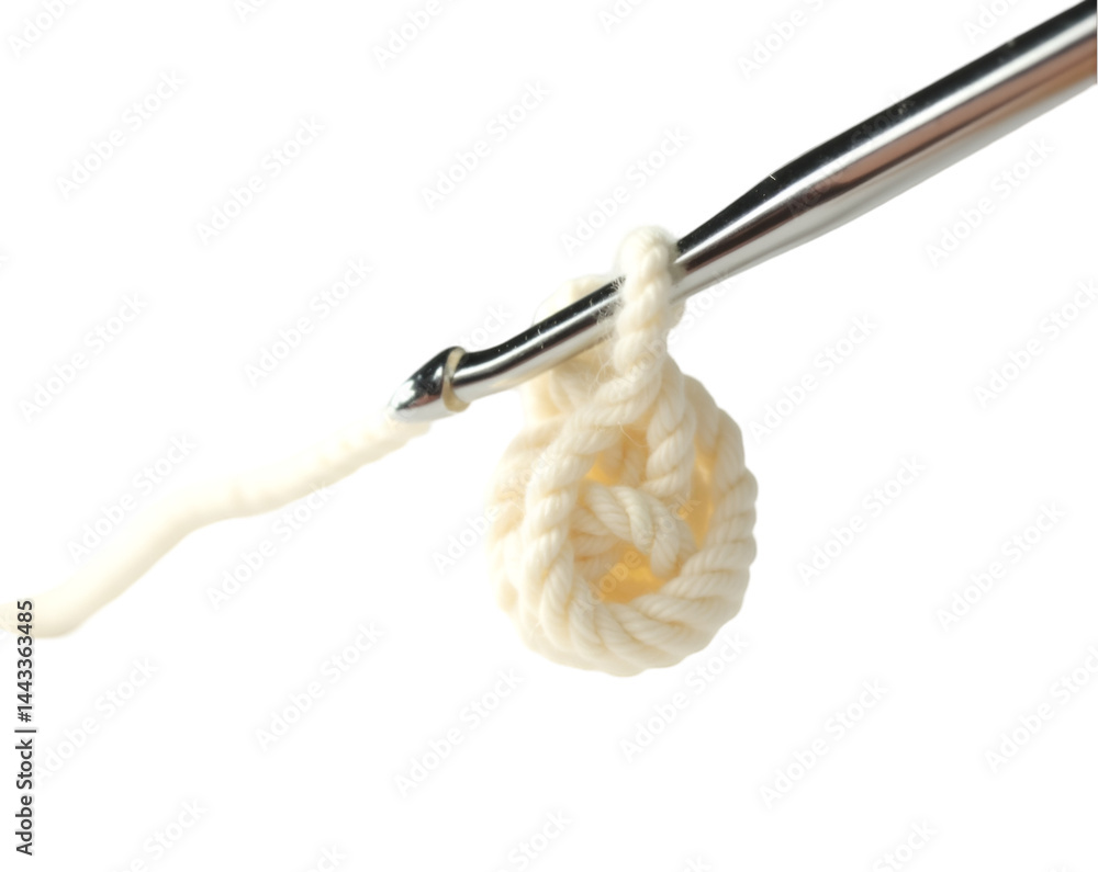 Aufkleber close-up of a shiny silver crochet hook with a partially formed loop, demonstrating the art of croch