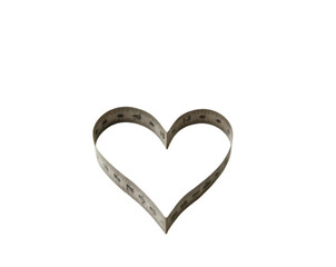 Obraz premium Conceptual art featuring a vintage metal tape measure precisely shaped into a heart symbolizing love measurement and affection for creative projects