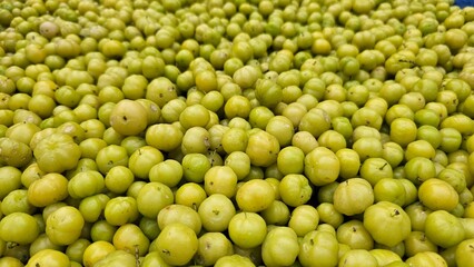 Fresh Orboroi fruits, Phyllanthus acidus, known as the Otaheite gooseberry, Malay gooseberry, star gooseberry. This fruit is piled up for sale. It is nutrient fruit as culinary and medically.