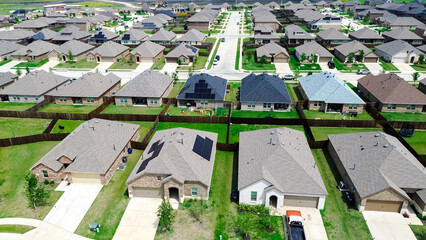 New construction home with solar panel roofs in rapid growing Princeton, Collin County, North Texas, clean energy efficiency home suburbs Dallas Fort Worth metroplex, upscale residential building
