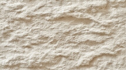 Obraz premium Textured light beige stone wall surface.