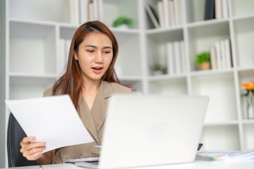 Engagement and Understanding. A woman responds positively during a virtual meeting, showing...