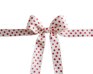 Festive polka dot ribbon bow tied elegantly on a pristine surface, perfect for gift wrapping, celebrations, and adding a touch of playful sophistication