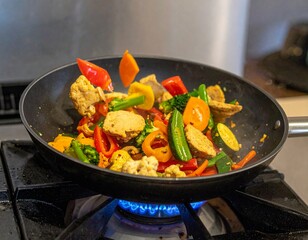 Vegan Seitan and mushrooms, tofu, broccoli, bean sprouts stir-fry in motion with vegetables tossed in a wok held by hands