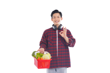 portrait of asian man holding shopping basket posing on white background, shopping concept