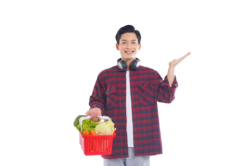 portrait of asian man holding shopping basket posing on white background, shopping concept