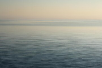 Fototapeta premium Close-up of calm, flat ocean surface under soft natural light