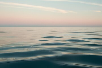 Obraz premium Close-up of calm, flat ocean surface under soft natural light