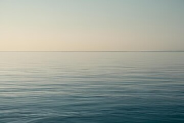 Obraz premium Close-up of calm, flat ocean surface under soft natural light