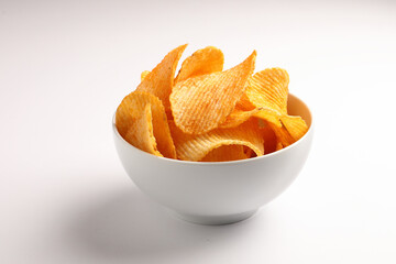 Crispy potato chips served in a bowl