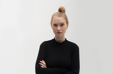 Isolated shot of a pretty offended blonde Ukrainian girl purses lips, having an insulted negative...