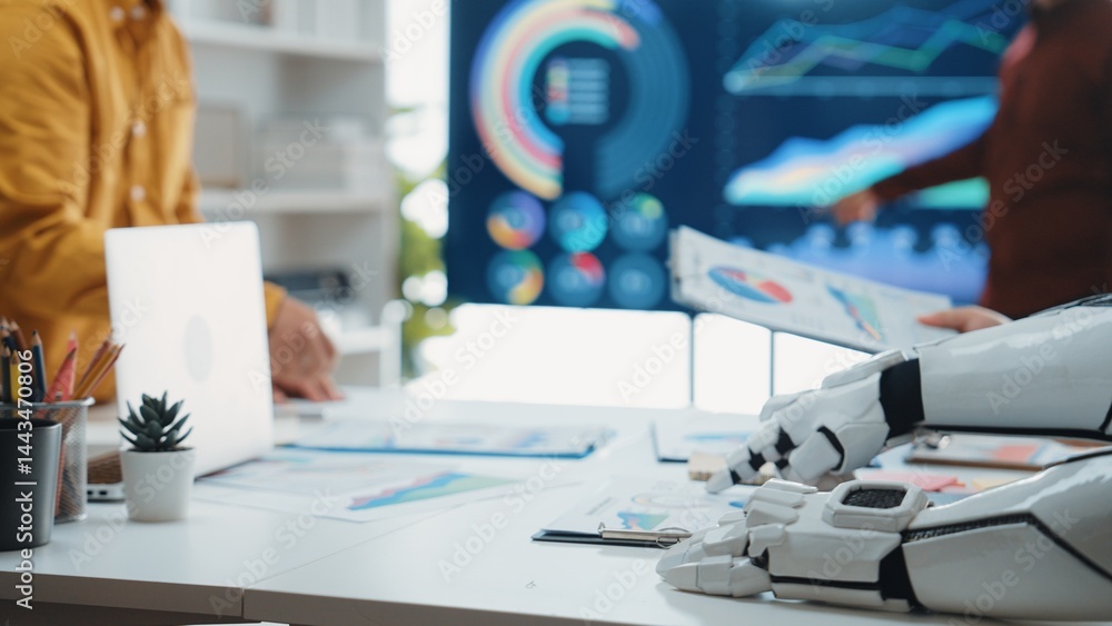 Poster a modern workspace showcasing the integration of robotics in business, featuring digital charts, col