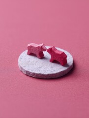 Two Abstract Red Bear Figures on a Minimalist Background