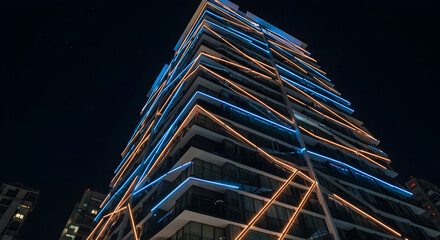 Fototapeta premium Contemporary Building At Night With Geometric Light Design Facade