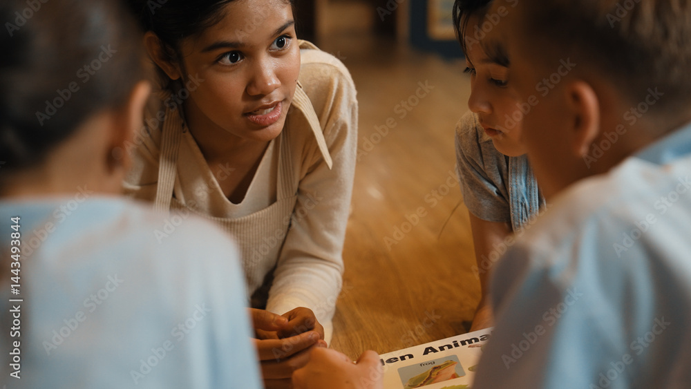 Poster caucasian girl sharing experience while reading a book together with multicultural friend at library