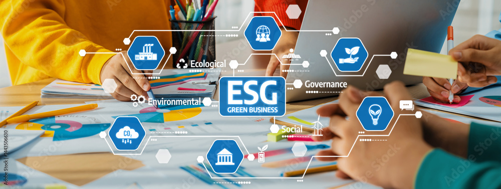 Aufkleber engaging team members work together in a vibrant office space, focusing on esg principles while util