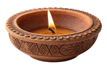 Lit diya oil lamp in a decorative terracotta bowl with flame glowing