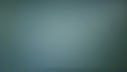Dark green smooth wall texture with subtle lighting gradient. Minimalist  background with copy space