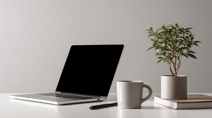 Minimalist Workspace: Laptop, Plant, and Coffee Mug in Serene Setting