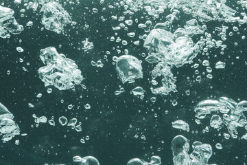 Many water bubbles on dark background, closeup
