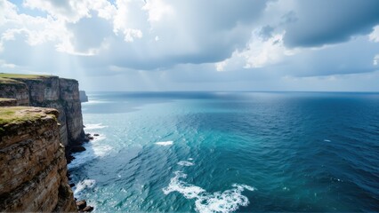 Fototapeta premium coastal cliff ocean photogenic. Scenic coastal view featuring cliffs and a vibrant ocean under a partly cloudy sky, showcasing the beauty of nature.