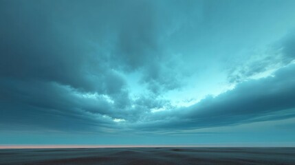 Obraz premium Landscape photograph of a vast open field with a vast sky in the background. the sky is a deep blue color with a few wispy clouds scattered across it.