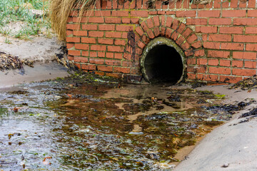 Sewage Outlet Pipe Discharging on Scottish Beach