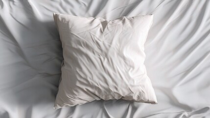 Obraz premium Soft White Pillow on Smooth Bedding for Cozy Bedroom Atmosphere