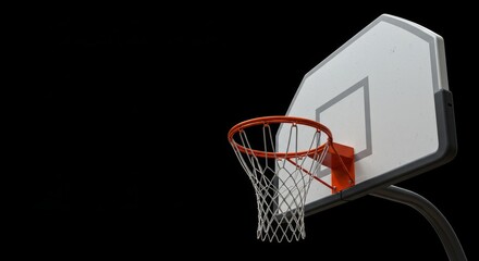 Naklejka premium Basketball Hoop on Black Background - A close-up of a basketball hoop against a stark black background. Symbolizing sport, competition, skill, ambition, and victory