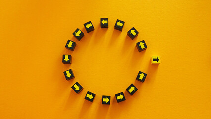 Circle of arrows with one going a different way. Thinking differently.