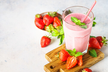 Strawberry smoothie or milkshake on white.