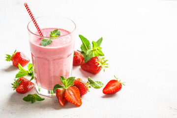 Strawberry smoothie or milkshake on white.