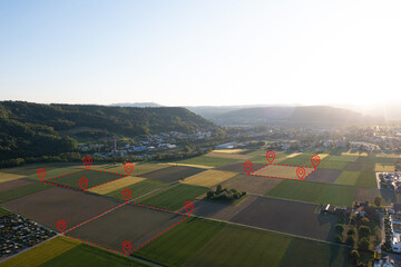 Land plot management - real estate concept with a vacant land on a green field available for...